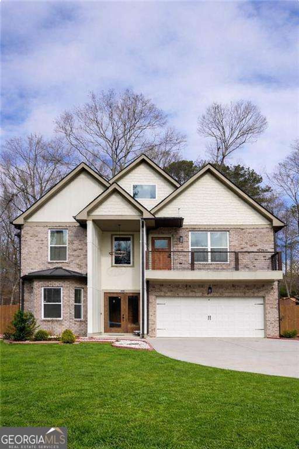 Photo of 658 Rockbridge Road, Lilburn, GA 30047 (MLS # 10738662)