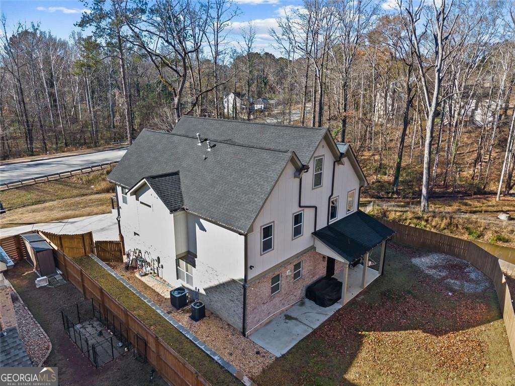 Photo of 658 Rockbridge Road, Lilburn, GA 30047 (MLS # 10738662)