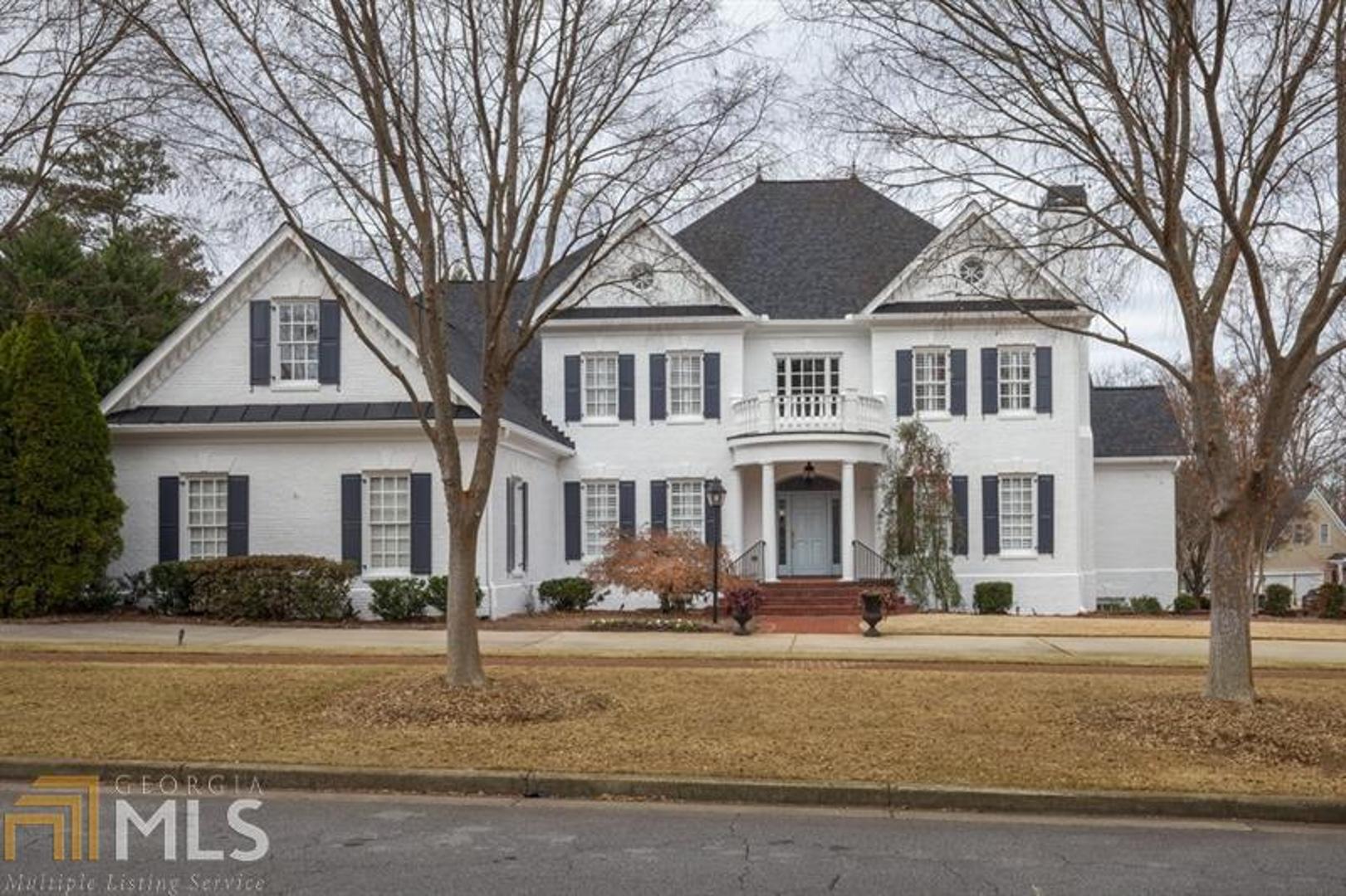 Just reduced -Stunning,all brick executive home with amazing updates, large square footage and a private backyard with pool. Located in one of East Cobb's top school districts and beautiful neighborhoods. This recently painted four side brick home features an open floor plan with an inviting entry foyer,formal living and dining rooms along with a study & a half bath. Kitchen with keeping room boast a massive stone fireplace, soaring ceilings and a large island perfect for entertaining a crowd.Updated commercial appliances,walk in pantry and a wet bar finish out