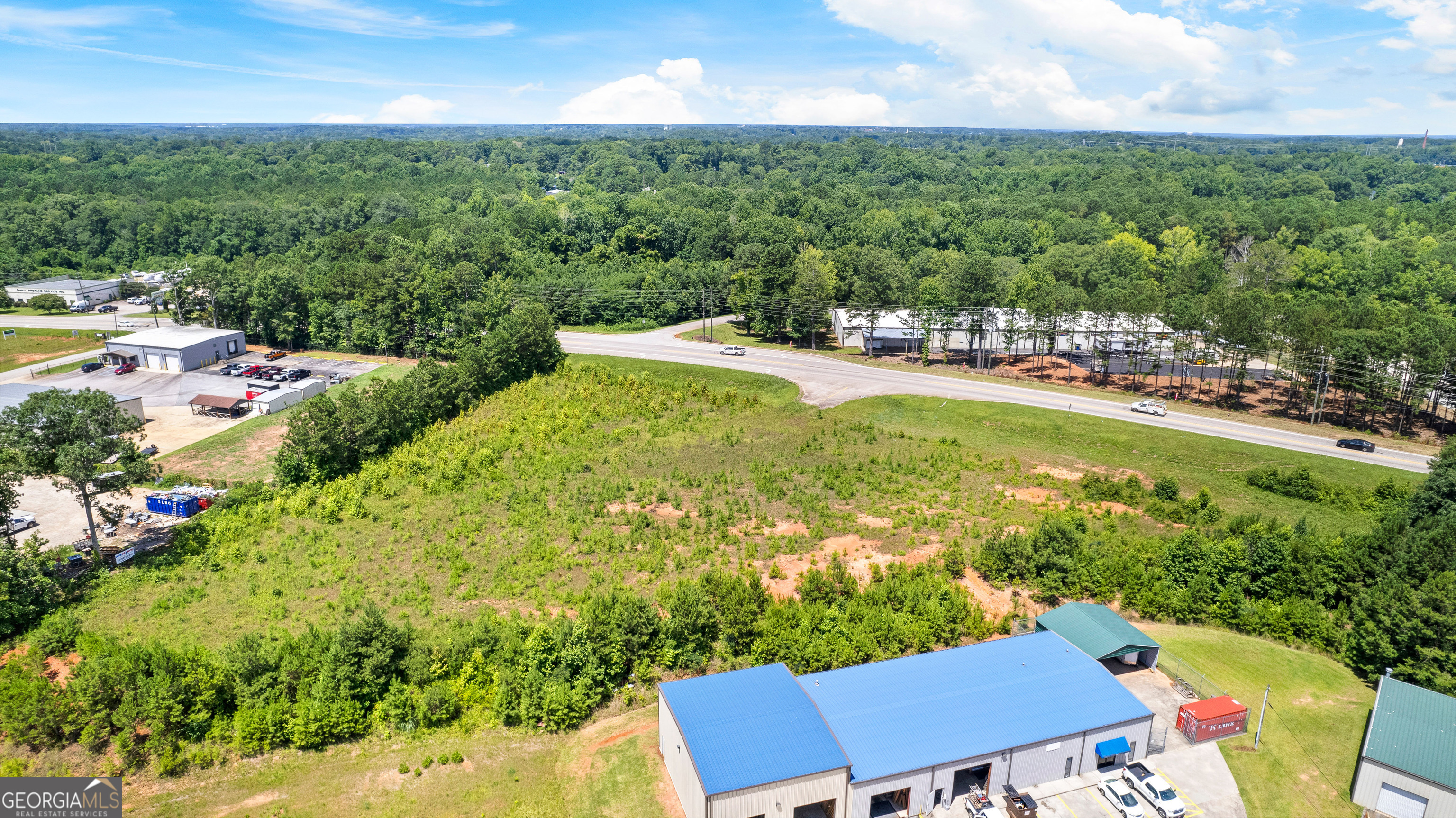 Great Location with easy access to Industrial Park and Interstate 85 & 185. Very Level double lot with over 2.4 acres. Deceleration Lane in place. Perfect Commercial or Industrial Location with great traffic count and visibility. City Water is Available.