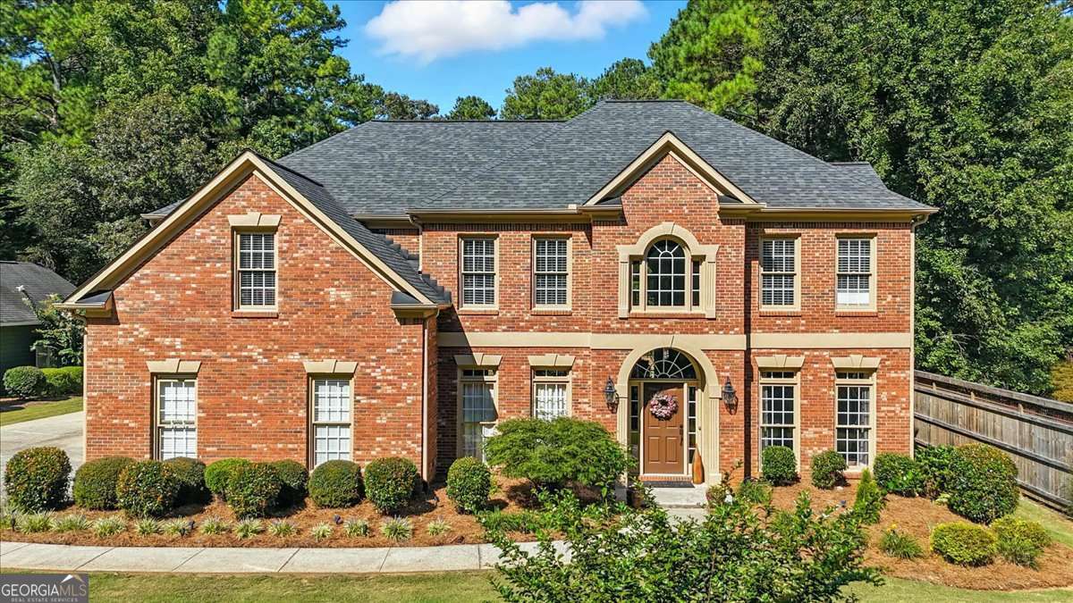 **BACK ON MARKET THROUGH NO FAULT OF SELLER** Welcome home to this beautifully maintained home in sought-after Camden Pointe, offering space, style, and versatility. A bright two-story foyer is flanked by spacious formal living and dining rooms, leading into a soaring two-story family room that seamlessly connects to a large breakfast area and an expansive kitchen with granite countertops, a double oven, and a large island. A main-level bedroom offers flexible use as a guest room, home office, or gym. Upstairs, the oversized primary suite features a luxurious bath with soaking tub, separate vanity area, and a massive walk-in closet. Two secondary bedrooms share a convenient Jack-and-Jill bath, while a fourth upstairs bedroom enjoys its own private bath. A well-appointed laundry room completes the upper level. The attached garage includes epoxy flooring and extra storage, while a detached two-car garage-added in 2016-offers even more parking, workshop space, and an extended driveway. Situated on one of the largest lots in the neighborhood, the beautifully landscaped backyard is perfect for entertaining, gardening, or relaxing around a fire pit. Enjoy top-rated schools, nearby shopping, and resort-style amenities including lakes, pickleball and tennis courts, and a swimming pool.