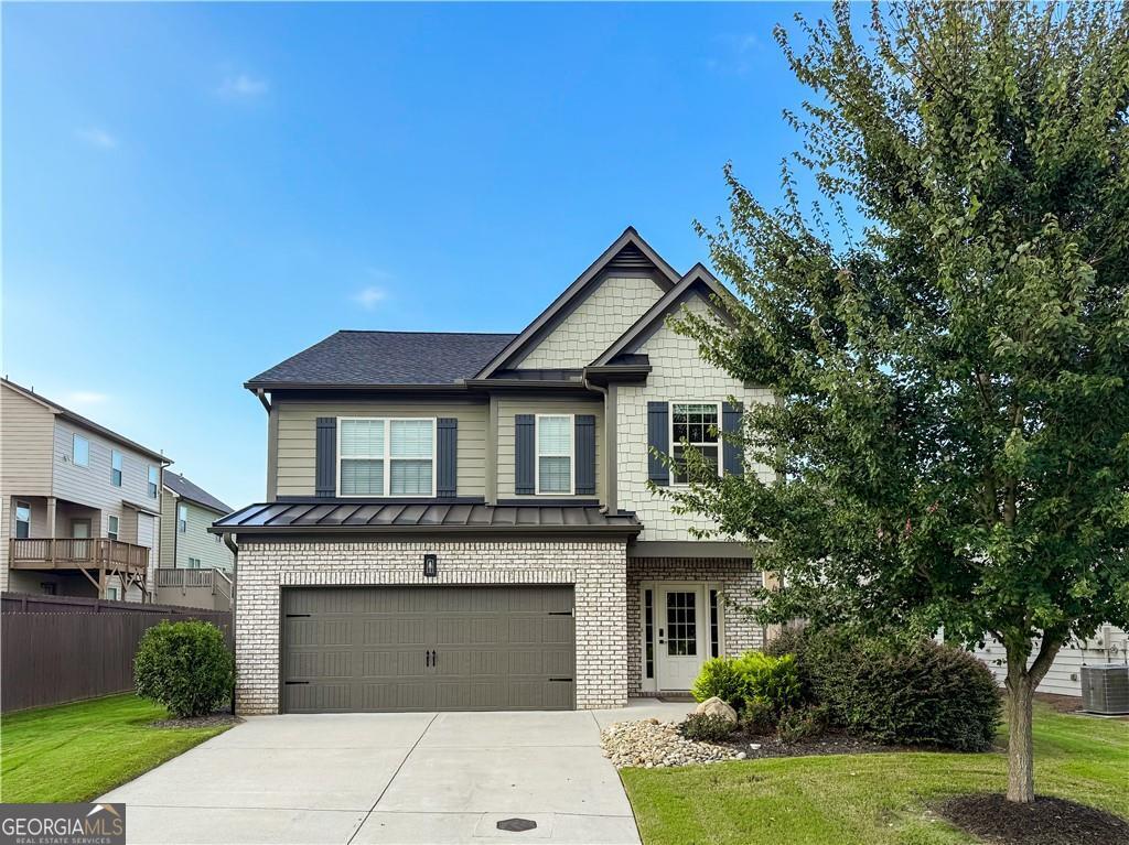 Welcome to this beautifully updated 3-bedroom, 2.5-bath home at 4215 Pembia Dr. in Cumming, GA, located just minutes from Hwy 400 and top-rated North Forsyth schools! Step inside to find thoughtful custom upgrades throughout, including a modern stair railing, designer light fixtures, and stunning accent details that set this home apart. Gorgeous LVP flooring flows throughout the home, adding both style and durability. The fireside family room creates a warm gathering space, while the kitchen impresses with white quartz countertops, custom-tiled island, premium appliances (including some KitchenAid), and abundant storage. Upstairs, the renovated owner's suite features a trey ceiling, a walk-in closet with custom organization, and a spa-inspired bath with double vanities and a large tiled shower. Secondary bedrooms are spacious and filled with natural light. Enjoy peace of mind with a new roof, plus outdoor living at its best with a fenced backyard and an extended concrete patio-perfect for entertaining or relaxing evenings at home. Situated in a desirable swim community and close to Coal Mountain Park and the coming soon Coal Mountain Town Center, this home is stylish, move-in ready, and waiting for its new owner!