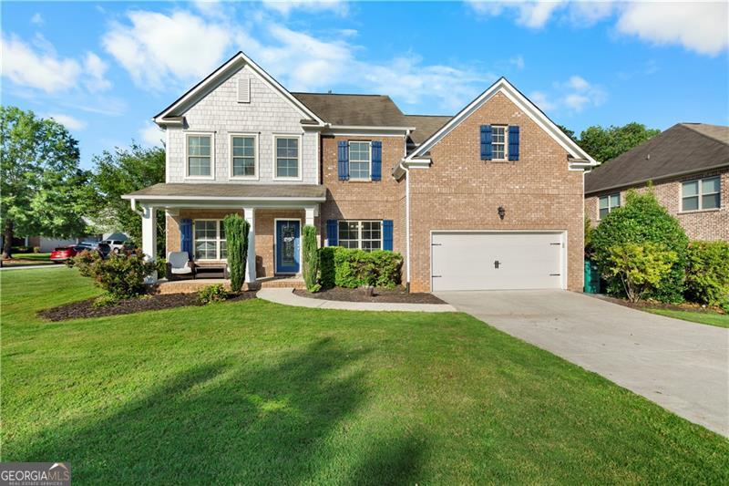 Welcome to your stunning home in Canton's highly sought-after Park at Steels Bridge community! This former model home boasts 5 bedrooms and 3 full baths, featuring an abundance of space magnified by high ceilings, natural light, and impeccable design details. Step inside to discover beautiful LVT flooring on the main level, leading you to an elegant dining room with a coffered ceiling. The great room is a showstopper, with soaring ceilings and a magnificent stacked-stone gas fireplace. The kitchen offers extensive cabinetry, stainless steel appliances, a large entertaining island, and granite countertops, all with a view to the great room. A main-level bedroom and full bath provide a versatile teen, in-law suite, or office. Upstairs, the stunning primary bedroom awaits, complete with two huge walk-in closets and a spa-like primary bath featuring a soaking tub, large tiled shower, and dual sinks. You'll also find oversized secondary bedrooms and a convenient laundry room. A full, unfinished basement, stubbed for a bath and ready for your personal touch. Entertain on the oversized private deck, which leads down to a beautiful, professionally landscaped, fenced yard with an irrigation system. The garage even features a 4-foot "bump-out," perfect for extra storage. Enjoy swim and tennis in the community, with memberships to the nearby Bridge Mill Athletic Club also available. Located in the top-rated Woodstock High School district and just minutes from I-575 and the recreational opportunities of Lake Allatoona, this home is a true gem!