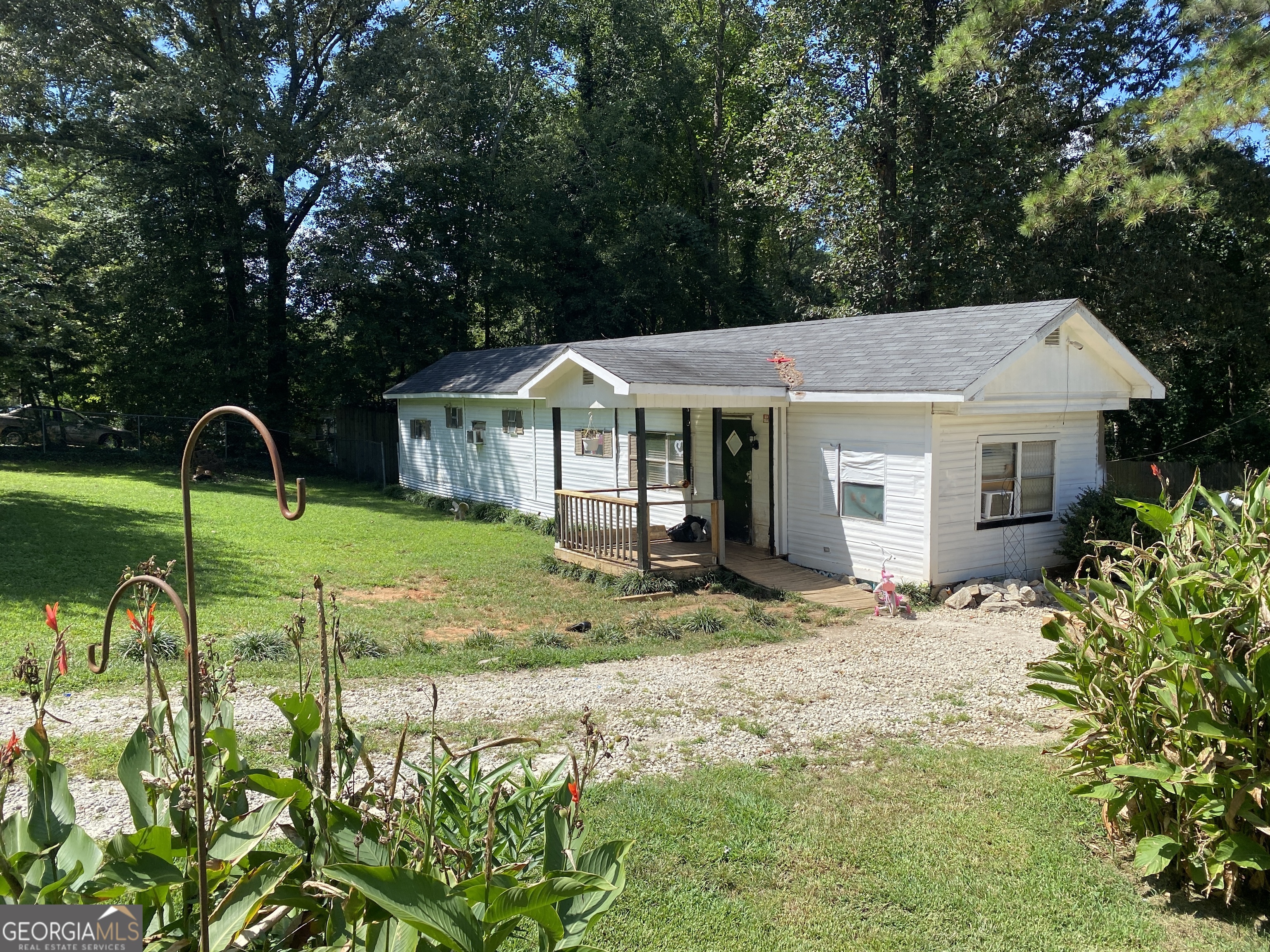 2BR/2BA mobile home on 0.47 acre lot for sale. Needs renovations. Good for primary residence or rental income. Front yard and back yard are level. Plenty of space for outdoor activities. Perimeter of the property is fenced. Space for RV/Boat/Automobile parking. Shown by appointment. Contact the listing agent with questions or to schedule a showing.