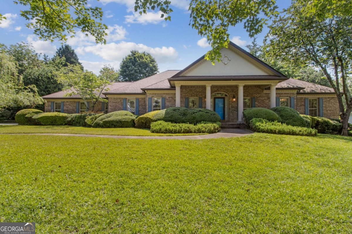 Charming Ranch on Full Basement in Established South Hall Neighborhood! Welcome to this spacious and well-maintained ranch-style home located in a desirable, established neighborhood in Gainesville, Georgia. Nestled in South Hall, this home offers the perfect blend of classic character, generous living space, and modern layout potential-all on a beautiful lot with mature landscaping. Step inside to discover a thoughtfully designed floor plan featuring 3 bedrooms and 2.5 bathrooms, ideal for comfortable everyday living and entertaining. The heart of the home is the oversized kitchen, complete with a center island with a vegetable sink, abundant cabinet space, a breakfast area, and a clear view into the large family room, perfect for gatherings and keeping everyone connected. Enjoy cozy evenings in the family room with a fireplace or unwind in the sunroom, ideal for relaxing with a book or morning coffee. Host dinner parties in the generously sized formal dining room and welcome guests in the spacious formal living room, offering versatile use as a home office or flex space. The primary suite is a true retreat, featuring a large walk-in closet, a spacious bathroom with a separate soaking tub and shower, and direct access to a private deck-a perfect spot for a future hot tub or peaceful outdoor escape. The full basement offers exceptional storage and expansion possibilities. It includes a finished bonus room-great for a media room, gym, or hobby space-as well as a boat door for convenient equipment storage or access. Two water heaters in the basement help ensure you'll never run out of hot water. Additional highlights include: 2-car side entry garage, ample storage throughout, great layout with room to personalize, and a beautiful established neighborhood. While this home has been well maintained over the years, it offers excellent potential for cosmetic updates, allowing you to bring your own style and design touches to make it truly yours. Don't miss the opportunity to own a solid, spacious home in a great location with tons of potential. Whether you're looking to renovate and resell or settle into your forever home with some updates, this property is a must-see!