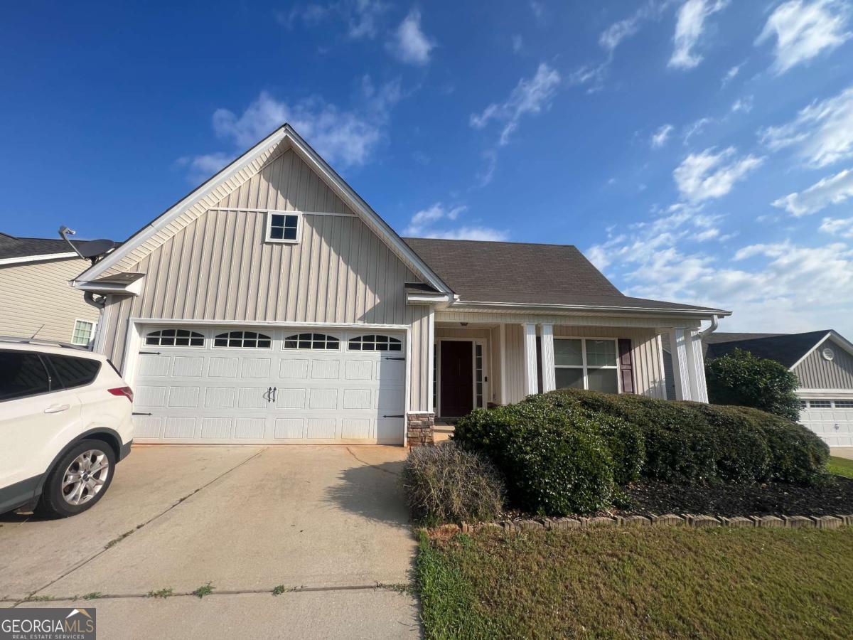 Prime location with easy access to Jefferson, Winder, Athens AND in the Jefferson City School District! This open-concept 3-bedroom, 2-bath home features soaring vaulted ceilings, spacious kitchen, a pantry, and a view into the large family room with fireplace-perfect for entertaining or cozy nights in. Enjoy the convenience of a 2-car garage and a patio ideal for outdoor living.