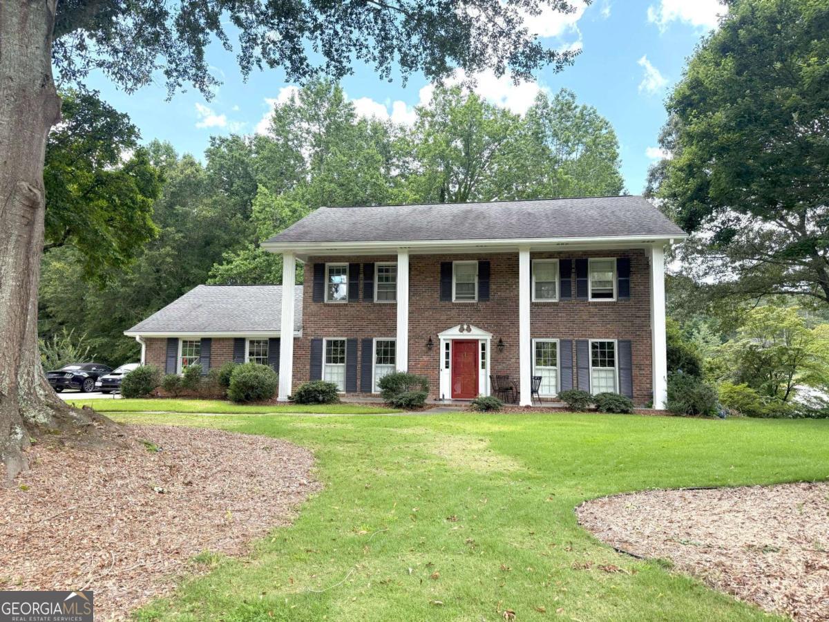 Beautiful traditional two-story with 4 columns front porch. Immaculate condition, hardwood floors, updated kitchen and bathrooms, huge screened porch, living room, separate fireside family room, large kitchen, and breakfast room with vaulted ceiling. Big laundry room with sink. Large bedrooms with plenty of closet space. 3 zone HVAC system. Full basement with lots of storage, vintage recreation room, and HVAC. Tenant occupied. Photos are from December 2022 when vacant. Still in great condition. NO PETS.