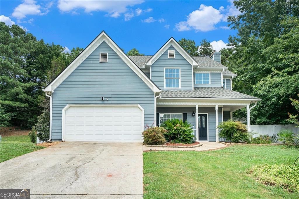 Come experience this cozy 4 Bed/ 2.5 Bath Farmhouse at the top of the cul-de-sac. You'll love the wrap around front porch as you enter the two-story foyer that leads to a great room with a gas fireplace. The open floor plan flows into the kitchen and there's also a formal dining room for family gatherings or entertaining your friends. The entire main floor shines with new LVP flooring and new paint throughout both floors. The kitchen has granite tile counters, and sandstone backsplash, with brand-new SS oven and dishwasher. There's plenty of cabinet space including a butler's counter adjacent to the dining room. Upstairs, escape to your private primary suite with a tray ceiling, two generous walk-in closets, and a spa-like ensuite bathroom featuring double vanities, shower, and a luxurious soaking tub. Three other generous bedrooms and a full bath complete the second floor. You'll enjoy gatherings on your covered back porch and private fenced yard with easy to maintain hardscapes and artificial turf and a convenient storage shed. The roof is less than a year old and the HVAC and water heater under 10 years old plus the seller is adding a one-year home warranty on all appliances, plumbing, and electric for peace of mind. Best of all, this home sits in a top-rated school district, has no HOA, and is just minutes from Suwanee Town Center, parks, and shopping. Don't miss your chance to own this beautifully updated farmhouse in one of the most desirable areas around!