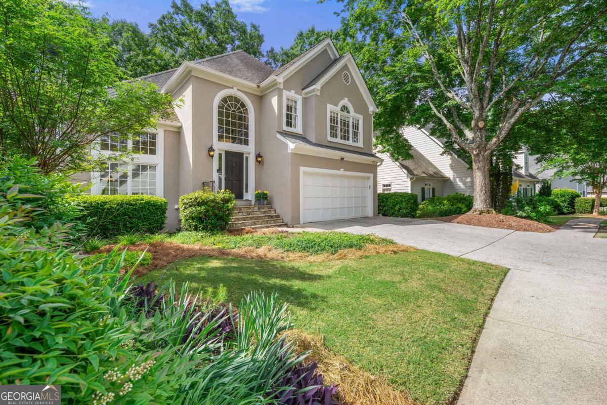 Welcome to Windward - A Storybook Escape with Unmatched Convenience Step into the charm of Windward, where every day feels like a Hallmark movie. Just 10 minutes from Avalon, Downtown Alpharetta, Halcyon, and North Point Mall, you're surrounded by top-tier shopping, dining, parks, and award-winning schools-yet it feels like you've been transported to the English countryside. This elegant home features a sunken family room with soaring two-story ceilings, seamlessly connected to a flexible dining area currently used as an office. The kitchen showcases a full wall of windows with tranquil, tree-lined views-perfect for peaceful mornings. A second cozy living area invites family movie nights or relaxed entertaining. Upstairs offers three spacious bedrooms, including a luxurious primary suite with a breathtaking view-plus a glimpse of the lake in winter. The terrace level provides an additional 1,400 sq. ft. of partially finished space, ideal for an in-law suite, guest quarters, or income-generating apartment. Take a short walk to the lake and enjoy quiet moments with a book under the sun. It's hard to believe you're still in Georgia. Windward offers resort-style amenities including swim, tennis, walking trails, parks, basketball courts, and direct lake access. This is more than a home-it's a lifestyle. Welcome to Windward.