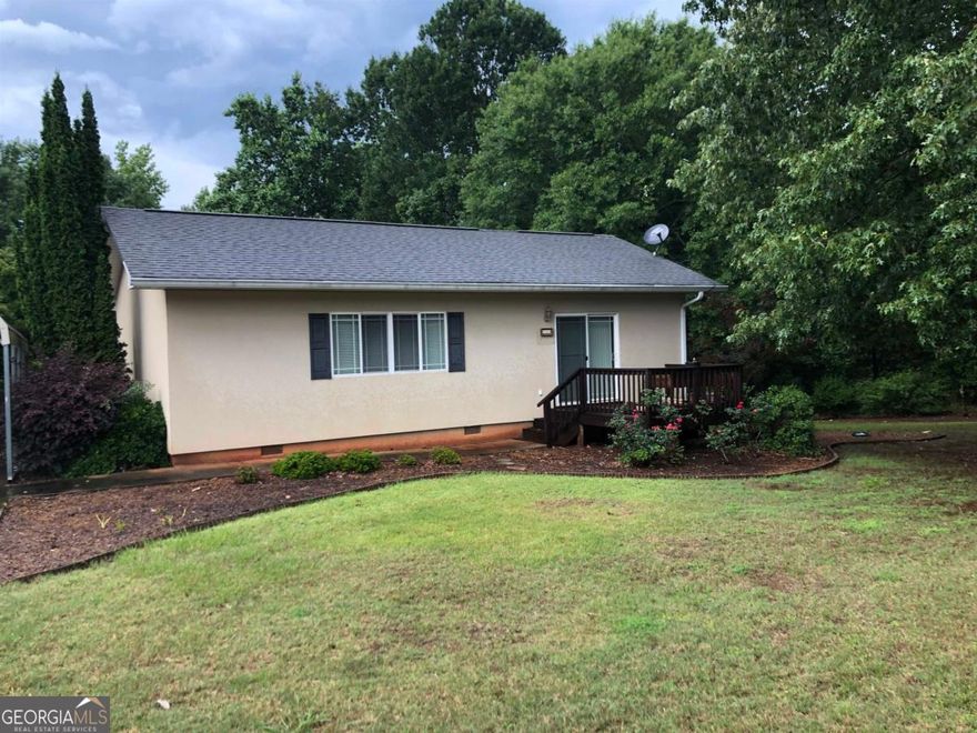 This is the original Florida build. Six inch cement blocks, stucco on the outside, make the utility build minimal, especially with the stately oaks. Gutter guards just installed, termite contract and warranty with Cingo in Dublin. Piedmont water, high crawl space. 2 walk in cedar closets, washer and dryer included. Quiet neighborhood. This place is beautifully landscaped and has a fenced garden spot with pear tree, plum tree, blueberries and lots of beds. Ideal home location is 14 minutes to Milledgeville and 15 minutes to Eatonton or Greensboro Publix.