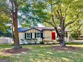 Welcome home to this Ellenwood gem that has been renovated with elegant upgrades throughout. As you approach the home, you're greeted by a "rocking chair" front porch, inviting you to relax and enjoy the beauty of the neighborhood.Step inside to discover an upgraded interior that exudes comfort and functionality. New flooring throughout, freshly painted interior and exterior, new lighting, new plumbing fixtures and so many more features make this home ideal for a move-in ready buyer.