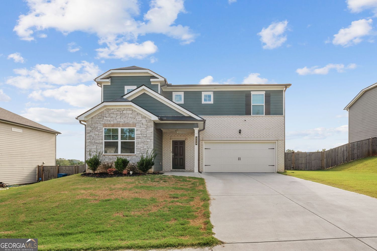 Discover this beautiful and thoughtfully designed home that is less than three years new. The open-concept layout seamlessly connects the living room, kitchen and dining area, creating a spacious and inviting atmosphere. The kitchen showcases white cabinets, granite countertops, a subway tile backsplash, stainless steel appliances, and a center island with bar seating. A walk-in pantry provides ample storage for all your culinary essentials. The living room features a modern electric fireplace with customizable heat and color controls, adding both warmth and ambiance-perfect for gathering with loved ones. On the main floor, a bedroom and full-size bath offer convenience and flexibility for guests or multigenerational living. Upstairs, the luxurious primary suite boasts a double vanity, walk-in shower, and separate soaking tub. There is also an oversized walk-in closet with more shelving than you may ever need!. The upper level also features three additional bedrooms and, as if you need even more space, a spacious loft, along with a full bath and a conveniently located laundry room. Outside, the fully fenced backyard offers privacy and functionality. The current owners extended and covered the back patio, creating the perfect spot for relaxing or entertaining year-round. Additional highlights include a two-car garage and fantastic neighborhood amenities, including a swimming pool and playground. The community is also within walking distance of an elementary school.