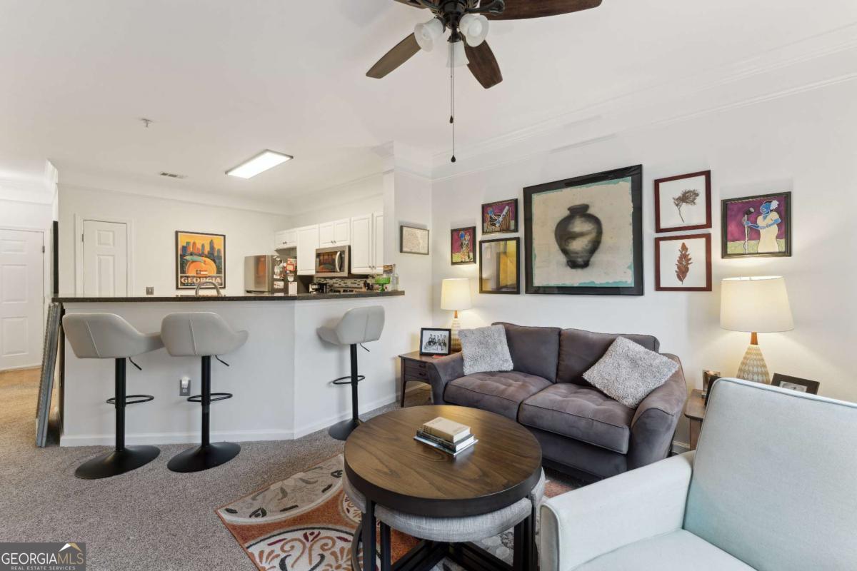 Welcome to 2122 Whitemarsh Way-an updated 1 bed, 1 bath condo located in The Merritt at Whitemarsh, a gated community offering resort-style amenities just minutes from downtown Savannah and the beaches of Tybee Island. This move-in ready home features an open floor plan filled with natural light, a spacious living area, and a screened-in porch perfect for morning coffee or evening wind-downs. The kitchen is thoughtfully updated with hard-surface countertops, stainless steel appliances, and a breakfast bar that opens to the main living space. The bathroom has been beautifully refreshed, and modern lighting fixtures have been installed throughout. Residents enjoy access to a sparkling pool, clubhouse, fitness center, business center, car wash station, and more-all tucked into lush, coastal surroundings. Low-maintenance living meets unbeatable location-don't miss your chance to call this condo home!
