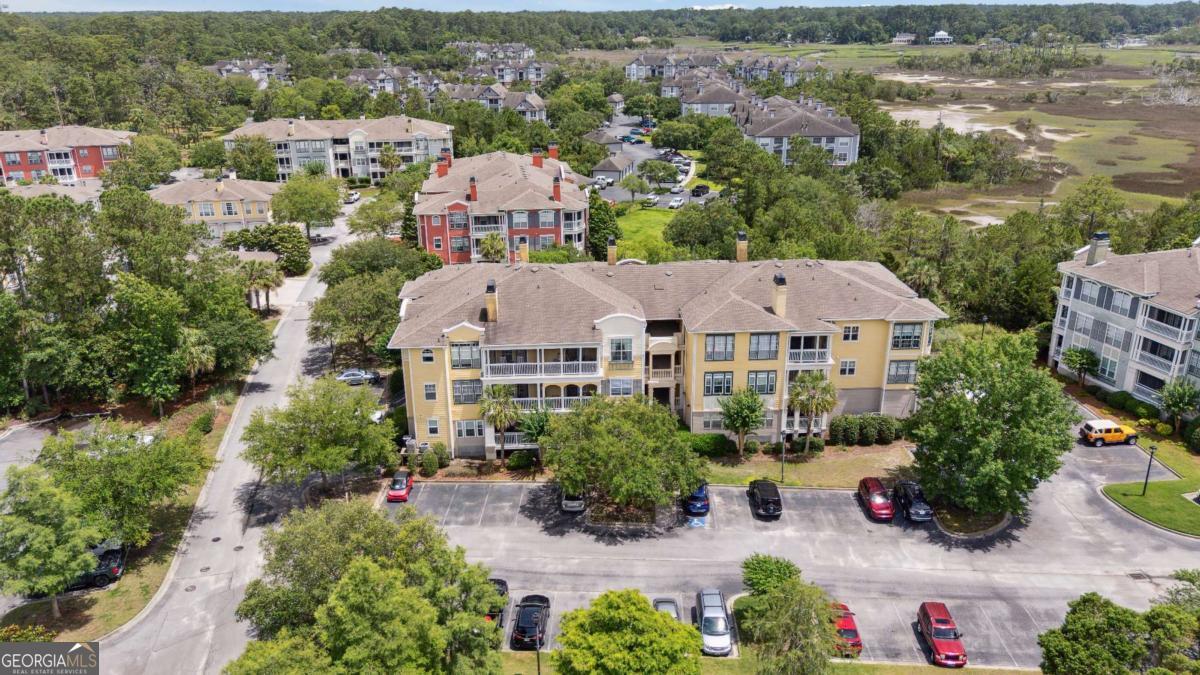Welcome to 2122 Whitemarsh Way-an updated 1 bed, 1 bath condo located in The Merritt at Whitemarsh, a gated community offering resort-style amenities just minutes from downtown Savannah and the beaches of Tybee Island. This move-in ready home features an open floor plan filled with natural light, a spacious living area, and a screened-in porch perfect for morning coffee or evening wind-downs. The kitchen is thoughtfully updated with hard-surface countertops, stainless steel appliances, and a breakfast bar that opens to the main living space. The bathroom has been beautifully refreshed, and modern lighting fixtures have been installed throughout. Residents enjoy access to a sparkling pool, clubhouse, fitness center, business center, car wash station, and more-all tucked into lush, coastal surroundings. Low-maintenance living meets unbeatable location-don't miss your chance to call this condo home!