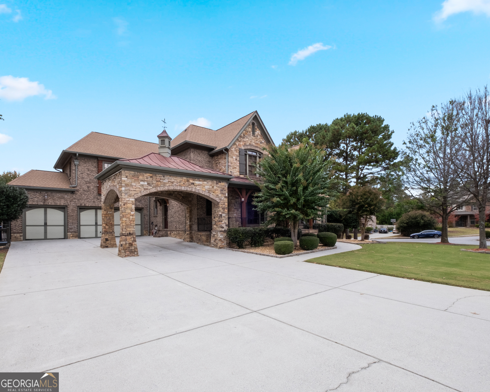 $50,000 price reduction! If you are a buyer this is your chance. This sprawling 6,800 sq ft with 4-sided brick/stone and modern estate in the prestigious Brookhaven neighborhood offers resort-style luxury and endless exposure without compromising privacy. Meticulously designed craftsmanship is a retreat of elegance and sophistication for those seeking the ultimate in comfort, beauty, and convenience. This home features 5 bedrooms and 4.5 bathrooms, a 3-car garage with 10+ parking driveway, 2 cozy fireplaces, hardwood floors, granite countertops, stainless steel appliances, a large backyard, a balcony, and a private screened porch. Upstairs, the lavish owner's suite features dual walk-in closets and a spa-inspired bath with heated floors. The finished terrace level provides endless entertainment options with a custom wine cellar. You will be amazed by the sunroom overlooking the large backyard, where you can relax or entertain guests in style. This home has everything you desire and wish, such as a laundry room with a washer and dryer, shelves, and a sink; a bonus room that can be used as an office, a playroom, or a guest room; crown molding, recessed lighting, and ceiling speakers throughout; and a security system and a smart thermostat for your safety and convenience. The scenic and friendly neighborhood amenities are top-notch, and provide access to Governors Towne Club's immaculate golf course, tennis courts, fitness center, pool, and more. Top-rated schools, The Collection at Forsyth upscale shopping/dining, and Avalon are minutes away. A Short walk to Brookwood Elementary School and Brookwood High School, or a drive to the Snellville Towne Center, which has a variety of shops, restaurants, and services. You can also explore Stone Mountain Park, which features hiking trails, scenic views, and family attractions. Don't just imagine the possibilities - make it a reality for you and your loved one.