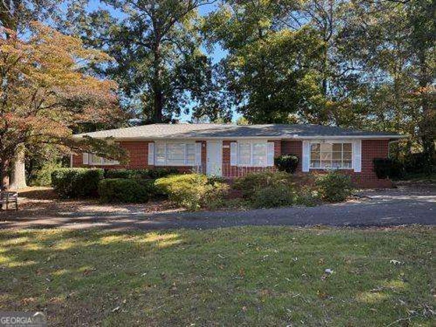 POTENTIAL COMMERCIAL! Investors Dream Opportunity!  Large double lot! Potential commercial for front half of lot on Canton Road, and residential lot on back half of lot with access to quiet Centerview Drive. This unique opportunity has a brick ranch home on front half of lot that has excellent visibility to approx 25,000 cars passing daily on Canton Road. Would make a great office space for any business, rental for easy income producing. One of the great features of this lot is the easy access from Canton Road but also easy exit via Red Oak Drive to Centerview Dr. Allowing safe and easy traffic flow for everyone. With the back half of this large parcel being a level wooded lot in the residential community of Noonday, you could build a spec home or another rental property. So many options. Best of all the existing home is a well maintained brick ranch with original hardwood floors. In 2019 Seller replaced all waterlines with copper, HVAC, Furnace, roof, and water heater. Home is bigger then tax records reflect with 2 car carport converted to a large family room with bay window and bookcases as well as a huge laundry room. This area could easily be converted to a nice primary suite with private bath to create a 4 bedroom 2 bath home....again, so many options in a fantastic location! Easy access to I-575 and I-75. Close to shopping and schools. Convenient to Marietta Sq. Located in a booming area with lots of great longtime businesses around. Don't miss out on this special opportunity!