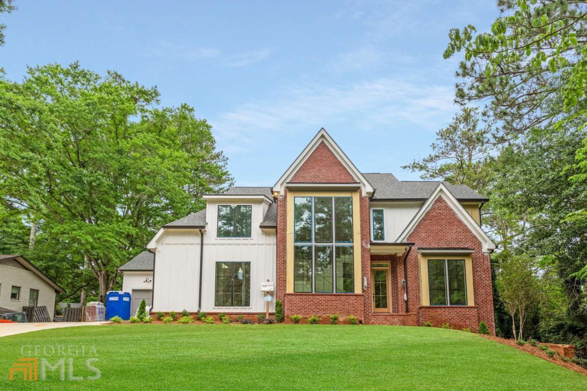 The BEST of both worlds! This SPECTACULAR new construction home is located on a beautiful .44 acre lot with an UNFINISHED BASEMENT and ROOM FOR A POOL in between Sandy Springs, Brookhaven, and North Buckhead. Only a short drive away from all of the shopping, dining, and nightlife they have to offer. The transitional exterior is complete with lush green landscaping, beautiful large windows, and a 3-car garage. You will be blown away by the flawless open layout from the moment you step foot in the door. Features include; European white oak hardwood floors, oversized windows, designer light fixtures, a guest bedroom, a full bathroom, and a powder bathroom all on the main level. The spacious family room is complete with custom built-ins, an inviting fireplace with a tile/wood accent surround, and western sliding doors leading you to the outdoor covered lounge. The chefs' kitchen has custom shaker cabinetry with soft close doors, quartz backsplash, high-end stainless steel appliances, a custom range hood, and a breakfast area. The vaulted owners' suite is complete with a spa-like bathroom featuring a jaw-dropping wet room with immaculate tile details, a soaking tub, double vanity, large custom closets, and a private water closet. To complete the second level, there is a large laundry room, three secondary bedrooms with private ensuites, and walk-in closets. Dont miss the AMAZING flat walk-out backyard with a covered outdoor lounge with fireplace and grilling patio. Amazing lot for a future pool!!