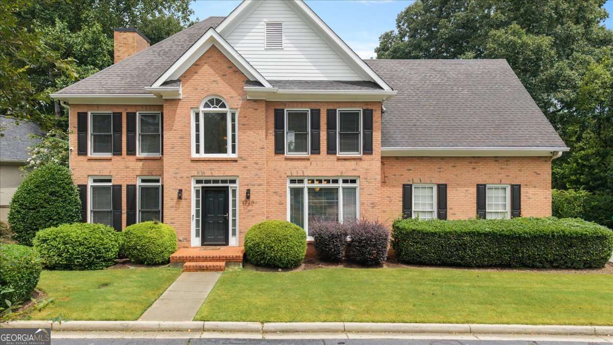 Beautiful 4-sided brick home on a quiet street in the perfect location! Just minutes from Dunwoody Village and Perimeter, and quick access to 285 and 400. Enjoy three finished levels of living space with a sunshine filled two story foyer, formal living and dining areas, and a spacious kitchen and family room. The updated kitchen is stunning and bright with new cabinetry, quartz countertops, and a new faucet and kitchen sink. Off of the kitchen is a large deck, overlooking a beautifully landscaped, fenced in backyard featuring huge privacy trees and plenty of room to run and play. Upstairs, you will find 4 spacious bedrooms, including an oversized Primary Bedroom with a separate living area or office. The large primary bathroom has been nicely updated and offers a large tub, spacious separate shower, and a generously sized walk-in closet. The basement is finished and features and kitchenette and full bath, perfect for a multi-generational family. This home has it all! Deck in lower yard has been digitally touched. Seller is offering $7,000 concession towards replacement of deck or removal of deck and new landscaping.
