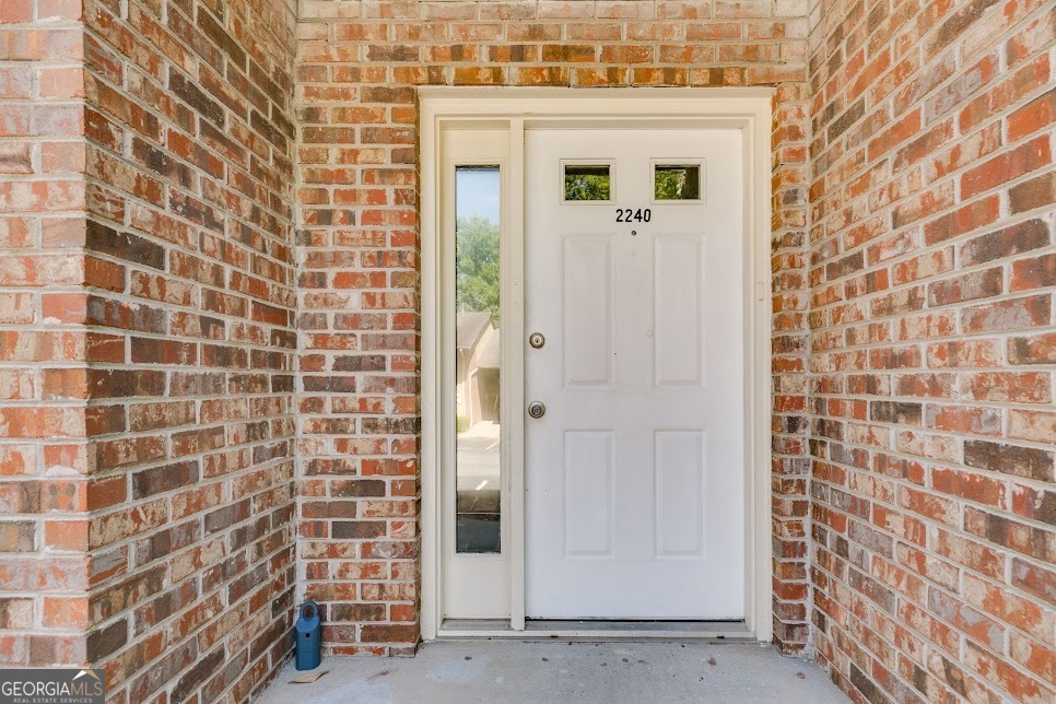 Welcome Home to Comfort, Style, and Convenience in the Heart of Marietta! Step into this beautifully maintained 2-bedroom, 2.5-bath townhome offering the perfect blend of modern updates and cozy charm. Located just minutes from I-75 and Truist Park, this home is nestled in a vibrant community with top-notch amenities and unbeatable convenience. Inside, you'll find new flooring, fresh paint, and stylish fixtures throughout. The updated kitchen features granite countertops, stainless steel appliances, and ample cabinet space, ideal for everyday cooking and entertaining. The open-concept layout flows seamlessly into a two-story dining area with views to the upper level, creating a bright and airy atmosphere. Relax by the fireplace in the spacious living room or step upstairs to two large bedrooms, each with its own private bathroom. The primary suite also includes private balcony access, perfect for morning coffee or winding down in the evening. Enjoy community perks like the swimming pool, tennis courts, and pet-friendly green spaces. With the HOA covering exterior maintenance, roof, water, trash, lawn care, and more, you'll love the ease of low-maintenance living.