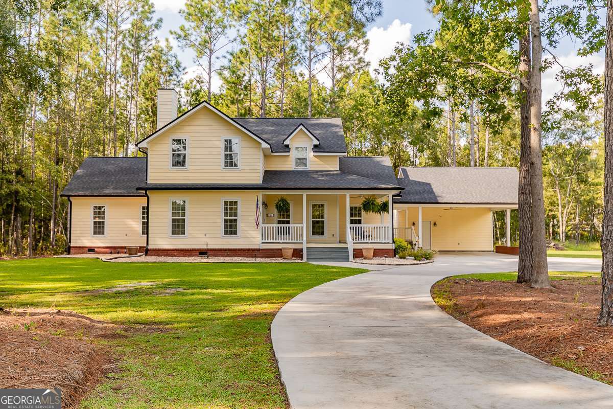 Your Own Piece of Paradise Awaits! Welcome to peace, privacy, and picturesque views-this stunning 2,725 sq ft home sits on 5.67 tranquil acres in the highly desirable South Effingham School District. Surrounded by nature and wildlife, this property offers the perfect blend of seclusion and convenience, just minutes from all the amenities of Rincon. Inside, you'll find a thoughtfully designed floor plan with space for the whole family. The main level features a cozy living room with fireplace, a separate sitting room for quiet moments, an updated kitchen with breakfast bar, breakfast area, and formal dining space, a dedicated home office, laundry room, and half bath. A charming sunroom with views of your private natural haven, set up for perfect football days! The spacious master suite has a massive walk-in closet, luxurious soaking tub, large walk-in shower, and double vanities Upstairs, there are two additional bedrooms and a full bath-perfect for children, guests, or flex space. Step outside and enjoy your large wrap-around porch, ideal for sipping sweet tea or a glass of wine as the sun sets and a 2-car attached carport offers additional storage and workshop space. Don't miss your chance to own this slice of Southern paradise-schedule your showing today!