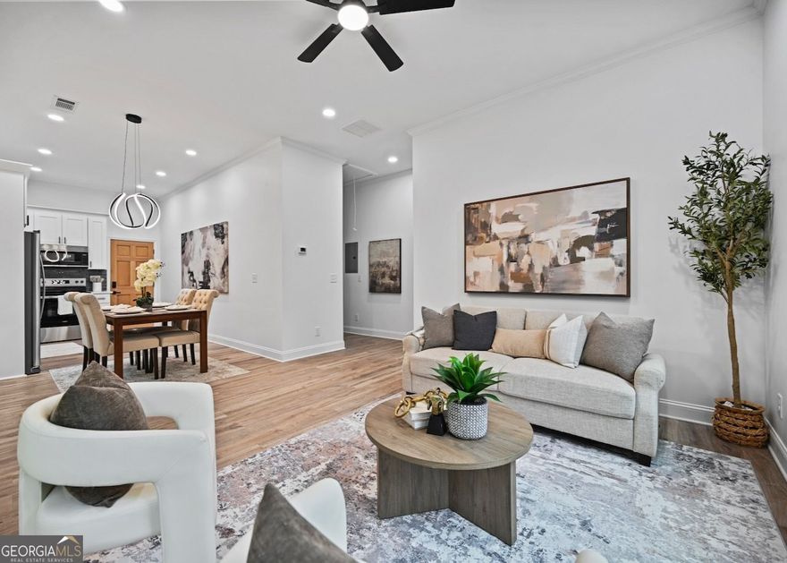 Welcome to your fully renovated home in East Point, yes, the one everyone's talking about. This property was redone with care and intention, featuring two bedrooms and two full bathrooms, a rare find for its original layout. You'll enjoy nine-foot ceilings, new windows, lots of light, new systems, new roof, fresh interior lighting, exterior Ring security lights, a doorbell camera, keyless entry, a new privacy fence in the backyard, and fresh sod in the front. Curb appeal here comes with a bit of character. The neighbor's siding has its own story, and the homes at the end of the block have tenure longer than your cousin's "temporary" stay on your couch. But step inside 1271 Pine Avenue, and it's a whole different story. Enter through the covered front porch into an open living, dining, and kitchen area, complete with a brand new appliance package and garbage disposal. Everything here is new and done right. The bathrooms are high-end and classically designed, with crisp white tile and river stone in the primary bath and clean white tile with a tub in the second. Both bedrooms include custom shelving built into the closets. The hallway laundry area accommodates a full-size side-by-side setup and is enclosed with doors for organization. Located near Tri-Cities High School, Kipp Academy, East Point MARTA station, the PATH Trail, and just a quick ride into downtown Atlanta, this home delivers convenience and value for working professionals, and anyone who knows a good underdog story when they see one. This home is move-in ready.