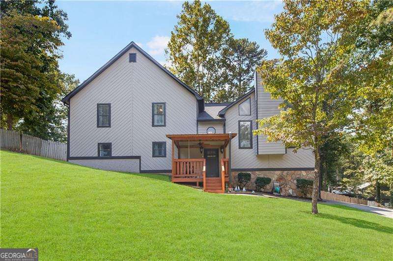 WOW- This home is HUGE!! Perfect for the growing family or great for investors with NO hoa restrictions!! Located in desriable East Paulding, this property offers incredible space and flexibility. The Large, open fireside family room flows into separate dining room and kitchen with abundant counter space, making entertianing a breeze. The oversized master suite features a sitting area, master bath has separate soaking tub and shower with double vanity, spacious master closet, secondary bedrooms next to the master with double vanity bathroom to share, huge bonus/game room perfect for kids play area, movie room or work from home office, step outside to a fenced backyard in culdesac ideal for gatherings or relaxing evenings. Recent updates include new roof, new covered deck and front porch, this home has many features ready for the next homeowner!!