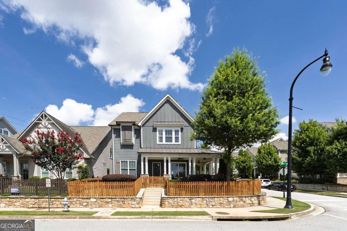 Welcome to 2108 Drew Drive in Atlanta's sought-after West Highlands community. Charm, comfort, and convenience come together in this beautifully maintained Craftsman style home. The inviting wrap-around porch is a perfect spot to relax in the shade or read a book on the porch swing. Stepping into the home, you'll be greeted by an open floor plan, beautiful hardwood floors, and abundant natural light throughout. The modern kitchen boasts marble countertops, stainless steel appliances, ample cabinet space, and a spacious pantry. A charming breakfast nook offers both comfort and practical everyday living. A large center island is perfect for additional prep space and gathering in a casual setting. The kitchen is open to the living room, providing space for relaxing in front of the gas fireplace or entertaining with friends. On the 2nd level, the generously sized primary suite is bright with natural light. The en-suite bathroom provides a spa-like experience with marble tile, double vanity, soaking tub, and all-glass walk-in shower. The spacious closet is equipped with an organized closet system, perfect for all of your clothes, shoes, and accessories. The 2 additional bedrooms share a full bath, accessible from each bedroom. The laundry room is also located on this level of the home, providing ease and accessibility. The third level has been renovated and is perfect for a fourth bedroom, private office, gym, home theater, or flex space to fit your needs. The space includes a full bathroom and unfinished area for your storage needs. Enjoy outdoor living on this sought-after corner lot with a private, fenced front and side yard and a charming porch. Oversized garage has plenty of space for 2 SUVs and also houses the tankless water heater. Tucked into a friendly, sidewalk-lined neighborhood with resort style amenities, it's just minutes from Westside Park, Proctor Creek Greenway path, Bellwood Quarry Westside Park, Westside Beltline Connector, and vibrant local shops and eateries. Easy access to Midtown, Buckhead, and downtown Atlanta. Whether you're a first-time buyer, a growing family, or simply looking for a move-in-ready gem near the heart of the city, 2108 Drew Drive is the one you've been waiting for!