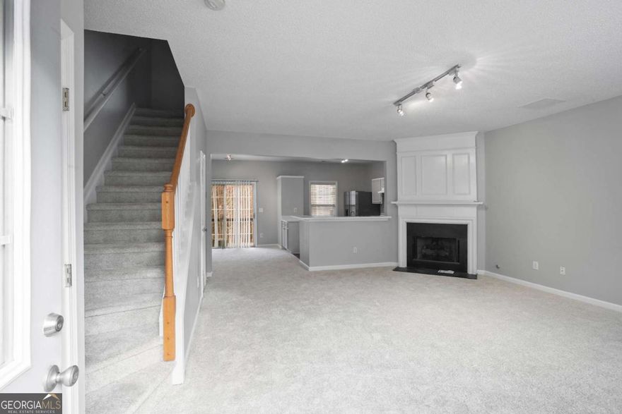 Beautiful townhouse in the highly sought-after Preserve at Nesbit Ferry community! This charming home features 3 spacious bedrooms, 2.5 bathrooms, and an open floor plan filled with natural light. Recently updated with fresh paint throughout, new carpet in every room, brand-new kitchen appliances, sink, and stunning countertops, this home is move-in ready. The kitchen includes stainless steel appliances, ample counter space, and an adjacent breakfast/dining area. Upstairs, youCOll find a conveniently located laundry closet and a luxurious primary suite with vaulted ceilings, a walk-in closet, double vanity, and a relaxing garden soaking tub. Two additional spacious bedrooms share a full bathroom. The Preserve at Nesbit Ferry is perfectly located near award-winning schools, great restaurants, and shopping. DonCOt miss this opportunity, apply now before itCOs gone!