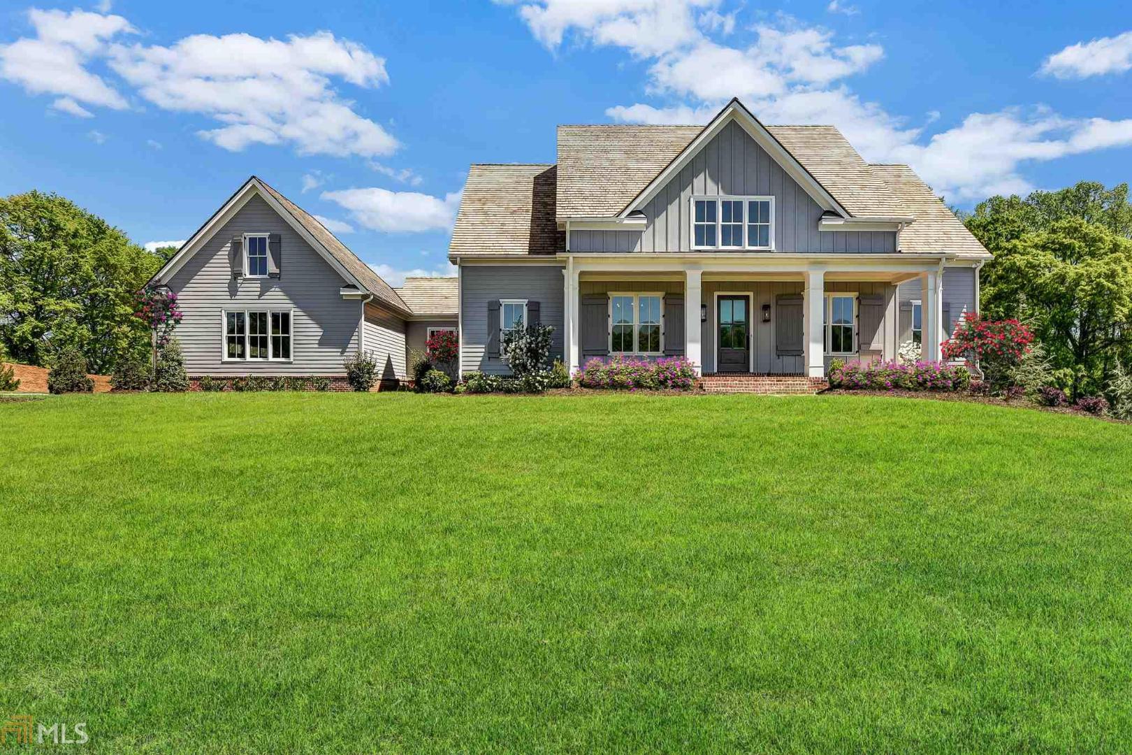 Absolutely Stunning! Impeccably appointed new construction modern farmhouse, welcoming foyer with shiplap walls, one of the most functional floor plans, large open family room overlooks the dream kitchen with butler's pantry, stone countertops and top of the line appliances. dining room w/brick accent wall, expansive built-in laundry/mudroom, master suite on the main w/vaulted ceiling & luxurious en-suite bath w/huge walk-in closet. Generous sized bedrooms w/private baths,full terrace level & walkout backyard offers space for a pool to create the private outdoor oasis!