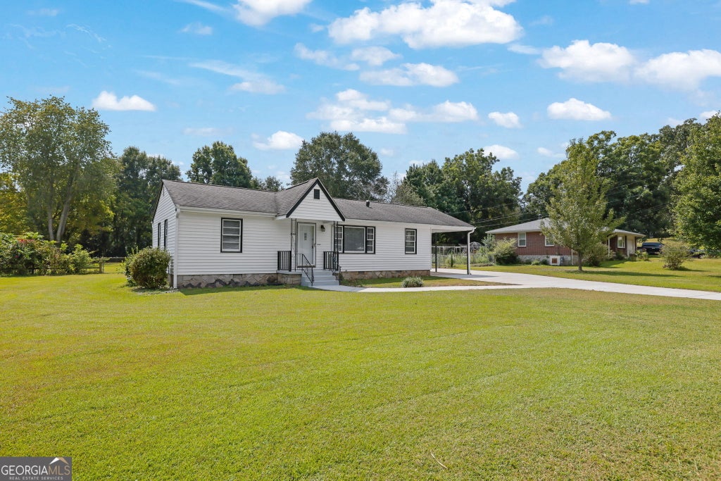 Photo of 1655 Lucelle Avenue, Stone Mountain, GA 30087 (MLS # 10835751)