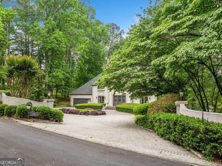 Elegant Golf Course Home with Lake Views in Atlanta Country Club Estates. Situated in the prestigious Atlanta Country Club Estates, this beautifully maintained home offers breathtaking views of a picturesque lake and pristine golf course. A perfect blend of sophistication and comfort, the residence features spacious interiors that invite both relaxation and entertaining. The kitchen, positioned adjacent to the main living areas, offers ample storage and workspace, ensuring both functionality and convenience. Upstairs, the ownerCOs suite is a private retreat, complete with an expansive sitting room and sweeping views of the fairway.  The finished terrace level provides additional space for entertainment, featuring a dedicated media room, a large recreation area, and seamless access to the outdoor retreat. Step outside to an expansive deck areaCoideal for gatherings, outdoor dining, or simply enjoying the serene landscape. The beautifully landscaped grounds and golf course views.