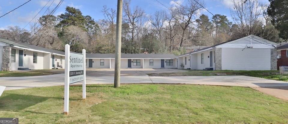 Welcome to Sentinel Apartments, an exceptional investment opportunity in Columbus, Georgia, located directly across from Fort Benning Military base. This 9-unit multifamily property includes 8 fully renovated units, each featuring 1 bedroom and 1 bathroom with identical layouts and modern finishes. Renovations include fresh paint, new flooring, remodeled kitchens, and upgraded bathrooms, ensuring an attractive and comfortable living experience for tenants. The property's exterior has been updated to enhance curb appeal, with improvements such as partial roof and driveway replacements. One unit remains ready for full renovation, offering a value-add opportunity for investors. With an average rent of $775 per unit and potential for utility bill back, Sentinel Apartments provides strong potential for consistent rental income. Conveniently situated near Fort Benning and a new Truck driving school, the Chattahoochee Riverwalk, dining, shopping, and other attractions, the property offers both comfort and convenience, making it highly desirable-especially among base soldiers. The property currently has one vacant unit and a fixer unit available for showings, with access to occupied units provided during the due diligence period. Please do not disturb tenants. Don't miss this incredible opportunity! (Agent-owned listing.) *No seller financing. Owner pays for water and trash, tenants pay for electric. Window AC units. Not central. No laundry hookups. Total electric.