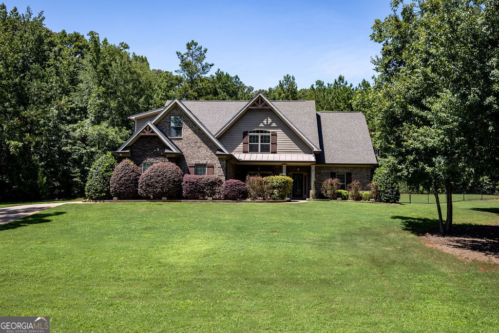 Stunning 5-Bedroom Home in River Forest. Located in River Forest and zoned for Monroe County Schools, this 5 bed, 3.5 bath home offers the perfect blend of comfort and luxury. The primary suite is conveniently located on the main floor, featuring a spacious bedroom, a large walk-in closet, and a luxurious en-suite bath. An open floorplan connects the living, dining, and kitchen areas-perfect for entertaining. Upstairs, you'll find a bonus room ideal for a playroom, office, or media space. Step outside to an impressive outdoor living space including a screened-in porch, swimming pool, and an outdoor kitchen-perfect for year-round enjoyment.