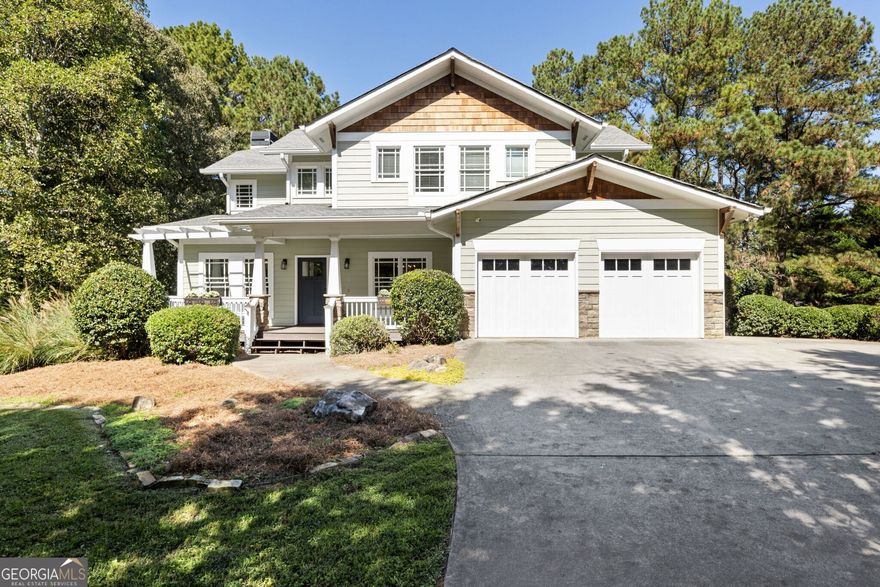Nestled on a scenic privately gated lot in Alpharetta, this beautifully crafted custom home seamlessly combines timeless architecture with modern convenience. Designed in the classic Craftsman style, it offers an elegant yet relaxed atmosphere, providing both space and privacy. The charming wide front porch greets you, creating a peaceful spot to unwind while admiring the beautifully landscaped front yard. As you enter, the foyer unveils a formal dining room to one side and a dedicated home office on the other. The main level features a bright, open layout with defined living and dining areas, accented by freshly updated hardwood floors, custom trim, and a stone fireplace that anchors the family room. Flanked by built-in bookcases, the fireplace creates a cozy focal point. From the family room, the screened-in porch seamlessly extends your living space outdoors, overlooking a sprawling fenced backyard-perfect for a garden, play area, or simply enjoying the outdoors. The kitchen is designed for style and efficiency, featuring granite countertops, a center island with seating, a high-end Thermador oven, stainless steel appliances, tile backsplash, and abundant cabinetry that provides excellent storage. Its open sight lines in the main living areas make it ideal for everyday living and entertaining. Upstairs, the spacious primary suite serves as a tranquil escape, featuring a large bedroom, two oversized closets, and a luxurious spa-style bathroom with a soaking tub, dual vanities, and a stand-alone tile shower. Just at the top of the stairs, a built-in office nook offers a quiet spot for work or study. Four additional bedrooms are thoughtfully laid out, providing versatility for guests, home offices, or extra living space. The fully finished terrace level adds valuable living space full bathroom, multiple storage closets, and access to the back patio. This flexible area is ideal for a media room, home office, gym, or guest suite. This exceptional property also includes a spacious two-car garage with plenty of vehicle room and additional storage. Located just minutes from Milton's renowned equestrian farms, this home offers convenient access to a vibrant mix of local dining, boutique shopping, and scenic beauty. Here, you'll enjoy the perfect blend of space, comfort, and privacy in one of North Georgia's most sought-after communities.