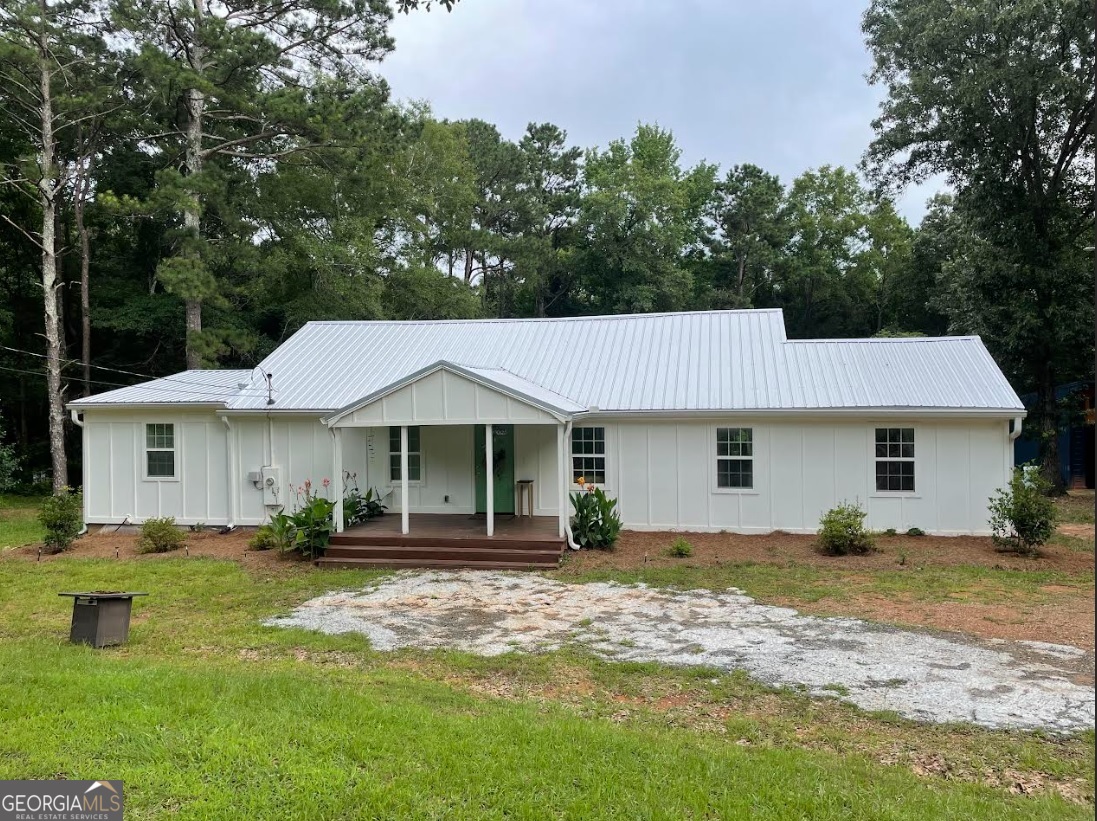 Take a look at this adorable property situated on on a generous 1 acre. The home has been remodeled inside and out! The roof is just a few years old. This home features an open living concept and a split bedroom plan. The kitchen and living space are open. There is a large laundry room and a pantry with rotating shelves to maximize storage. Relax in the soaking tub in the primary bathroom. There is a separate shower and smart mirrors. The back deck is perfect for your morning coffee and overlooking the backyard. There is a detached garage space with two bays, and a storage shed too.