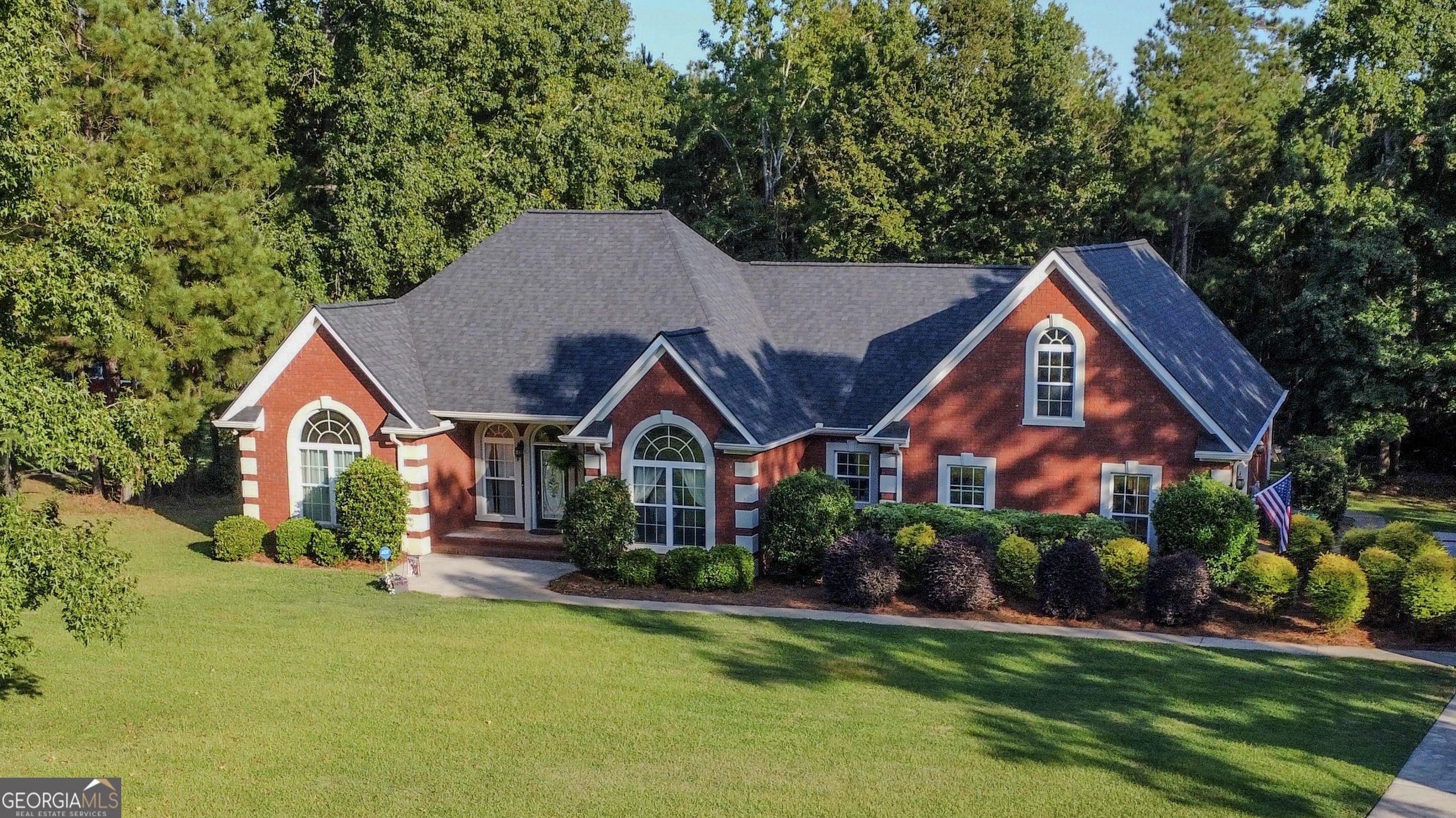 Welcome to this beautifully maintained, 3 bedroom, 2.5 bath, all brick home in a well desired community. This property is sure to please with inviting spaces, and a private outdoor retreat on 1.46 acres, all in a prime location. Inside, you'll find an open, light filled floor plan designed for both comfort and entertaining. The kitchen features abundant cabinetry, ample counter space, breakfast area and easy flow into the separate dining room for gatherings. The spacious living room provides a welcoming atmosphere, cozy fireplace, perfect for relaxing evenings at home or hosting family and friends. The generously sized primary suite offers an en-suite bathroom with soaking tub, separate shower, double vanity sink and plenty of closet space. Two additional bedrooms share a well appointed full bath, while a convenient half bath adds functionality. With thoughtful details throughout, this home is move in ready and waiting for its next owners. Step outside to enjoy your own backyard oasis. The property is beautifully maintained. Unwind around the cozy fire pit or indulge in the luxurious hot tub, designed for year round use and ideal for both relaxing soaks and entertaining guests. Whether it's a crisp fall evening or a summer night under the stars, this outdoor space invites you to slow down and savor the setting. A versatile she/he shed with power and air conditioning adds even more options, whether you need a home office, art studio, hobby room, or a quiet getaway. With nearly an acre and a half, there's room to enjoy the outdoors while still maintaining a manageable lifestyle. This home has been meticulously cared for with a brand new roof (2024), new HVAC system (2023), and the septic system serviced in 2024 ensuring comfort and peace of mind for years to come. Location is another highlight, just minutes from shopping, dining, historic downtown Milledgeville and Lake Sinclair giving plenty of opportunity for boating, fishing and enjoying the natural beauty that makes this area so desirable. Don't miss your chance to own this exceptional property at 384 Lakemere Lane, where style, comfort, and convenience come together. Schedule your private showing today and experience everything this home has to offer!