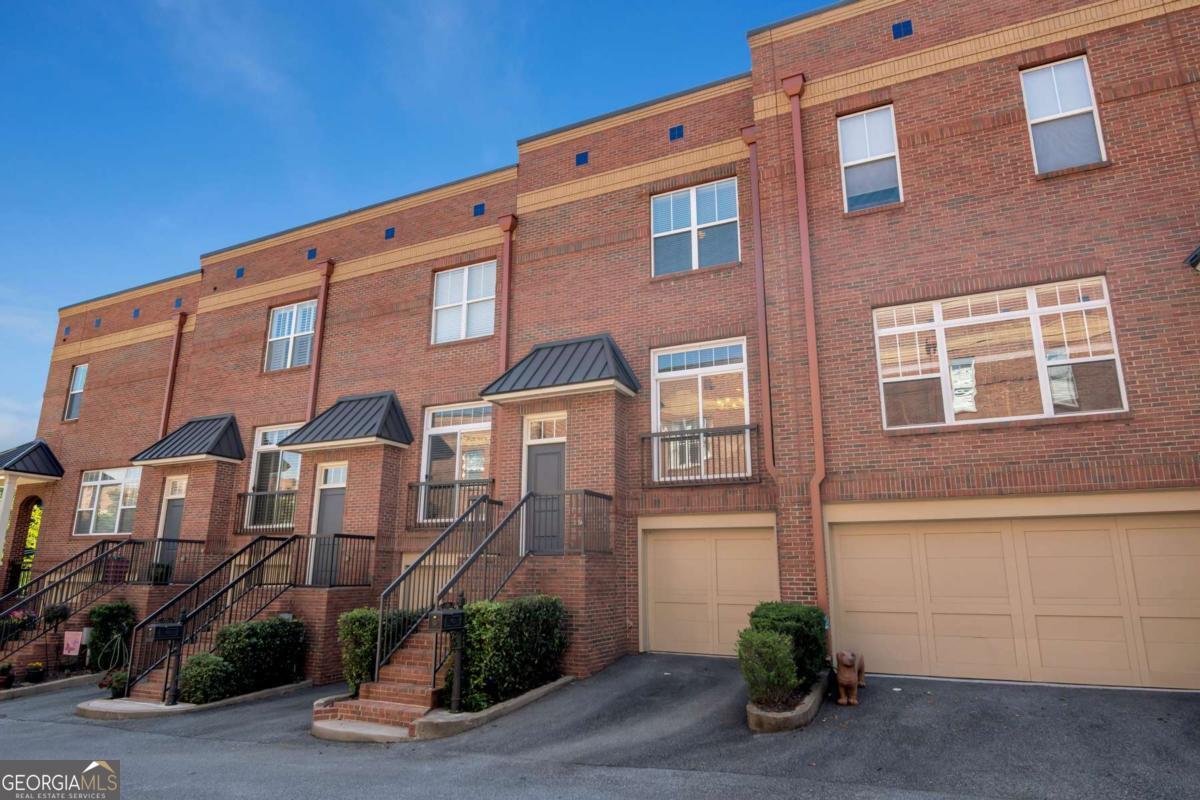 Look no further! Gorgeous townhome in gated community just a stones throw to the bustling Historic Marietta Square! Surrounded by retail, restaurants, Farmer's Market and parks, so walkable you'll hardly use your car! Gorgeous 3 bedroom, 4.5 bath, plus Bonus Loft/Recreation space w/wet bar and 2 roof top decks! Tons of natural light throughout, high ceilings, hardwood floors, 2 car tandem garage with plenty of room for storage. Gourmet's kitchen w/SS appliances, granite counters, and abundant cabinetry opens to the fireside living room and the separate dining room! Primary Suite Retreat with 2 walk in closets, bathroom features double vanity, soaking tub and separate shower. Both secondary bedrooms also have private en-suite baths. The amazing bonus loft space upstairs also has a full bath, wet bar, 2nd fridge and is perfect for media/recreation/guest suite and don't miss the scenic views from the 2 rooftop decks, great for grilling and relaxing. Close to interstates, What more can I add, just a great home and a great place to be! Pets are case by case basis. All occupants 18 and over must complete an application. Application fee is non-refundable $40 per person.