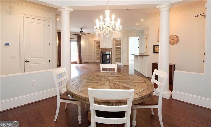 A must see! Walk to Marietta Square, grab dinner or a free concert! Gorgeous updated single level 3 bedroom, 3 bath condo. Quiet street and desirable building. Only 18 units.  You will enjoy the beautiful built-in shelving, crown moulding, and hardwood flooring. Enjoy entertaining in the rooftop common room and large deck with beautiful views of Kennesaw Mountain. Units rarely come available in this beautiful federal style building. Come see unit #208 today!