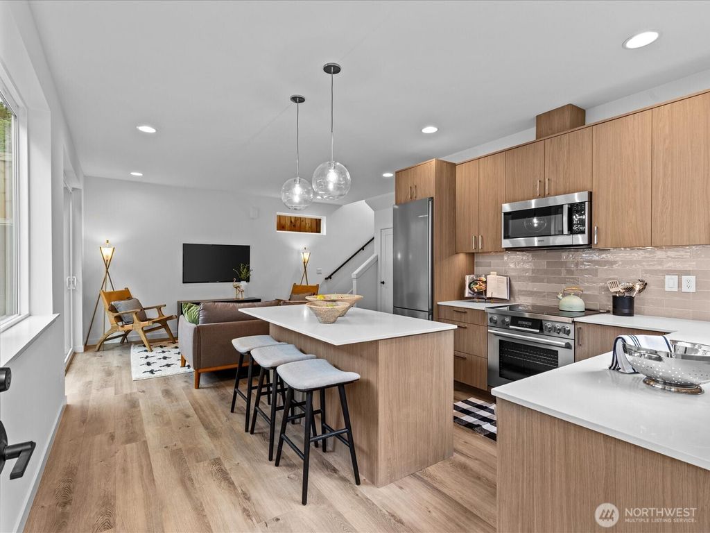 Photo of 9019 Dibble Avenue NW #B, Seattle, WA 98117 (MLS # 2407859)