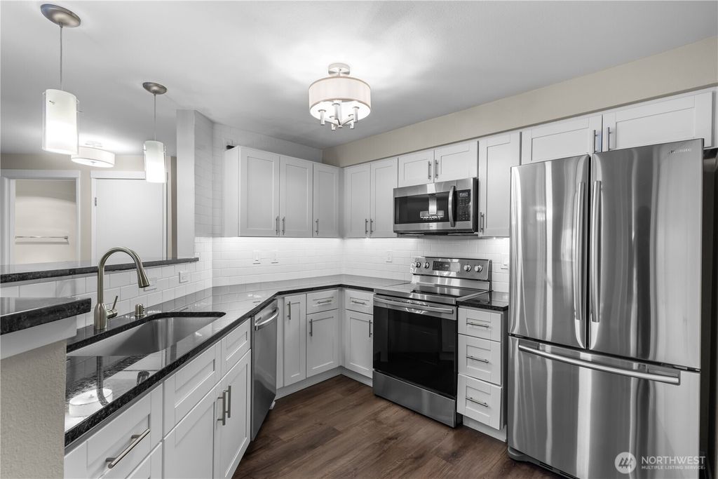 Photo of 7711 NE 175th Street #F104, Kenmore, WA 98028 (MLS # 2502951)