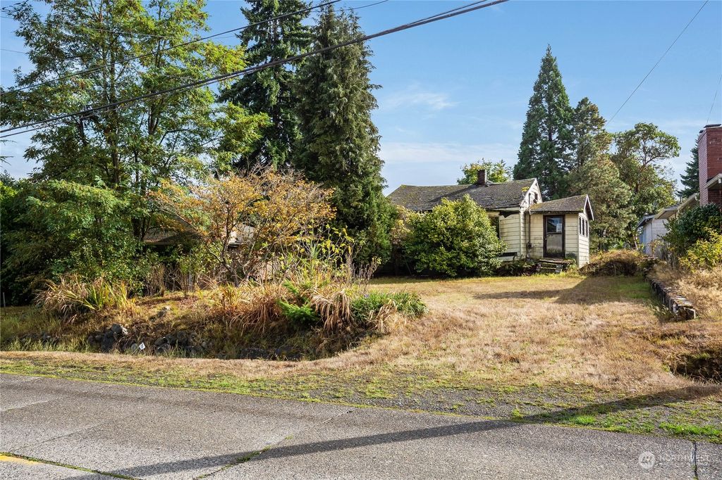 Photo of 3735 SW 100th Street, Seattle, WA 98146 (MLS # 2165915)