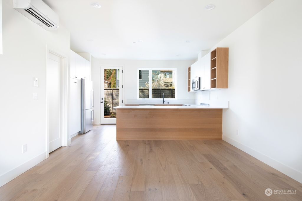 Photo of 13321 1st Avenue NE #B, Seattle, WA 98125 (MLS # 2060446)