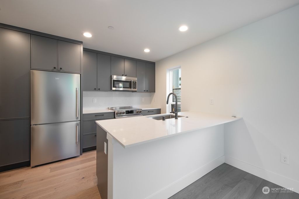 Photo of 13323 1st Avenue NE #C, Seattle, WA 98125 (MLS # 2077887)