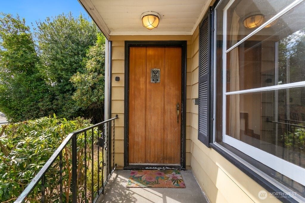 Photo of 8445 30th Avenue SW, Seattle, WA 98126 (MLS # 2423260)