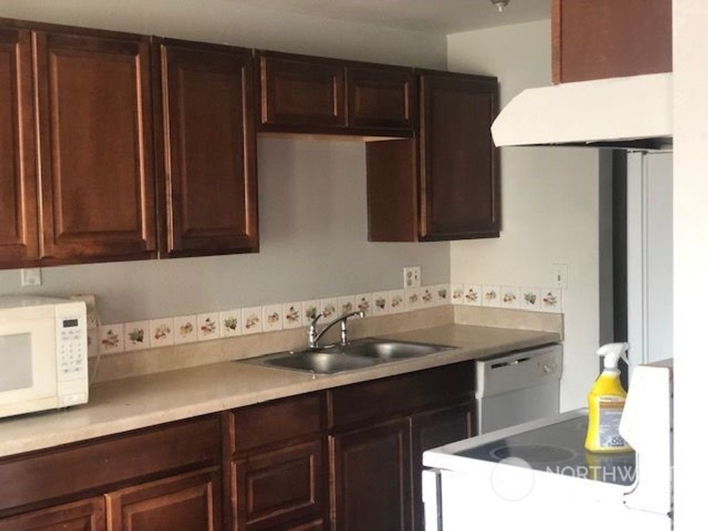 Photo of 15210 S MACADAM Road #D210, Tukwila, WA 98188 (MLS # 2212063)