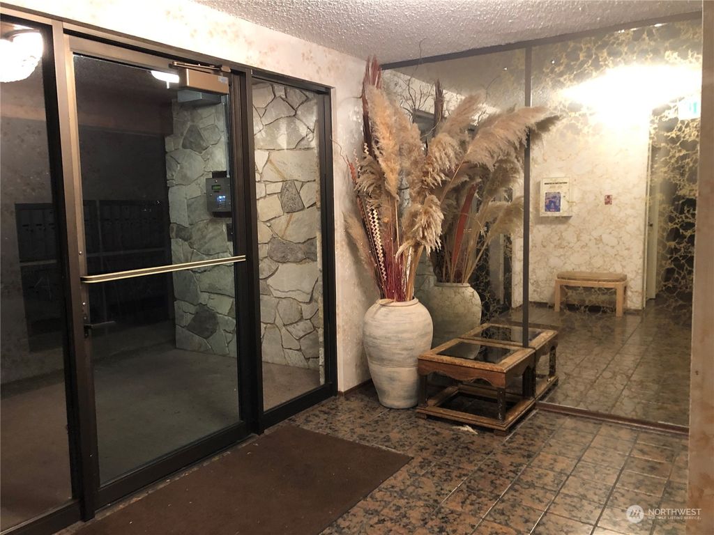 Photo of 13433 Roosevelt Way N #103, Seattle, WA 98133 (MLS # 2049098)