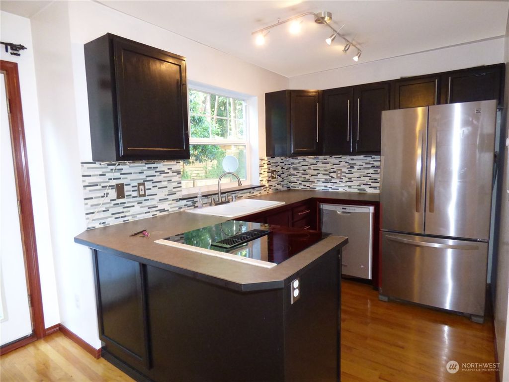 Photo of 10717 Burke Avenue N #G, Seattle, WA 98133 (MLS # 2128922)