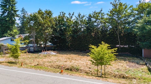 Photo of 2411 SW 104th Street, Seattle, WA 98146 (MLS # 2574022)
