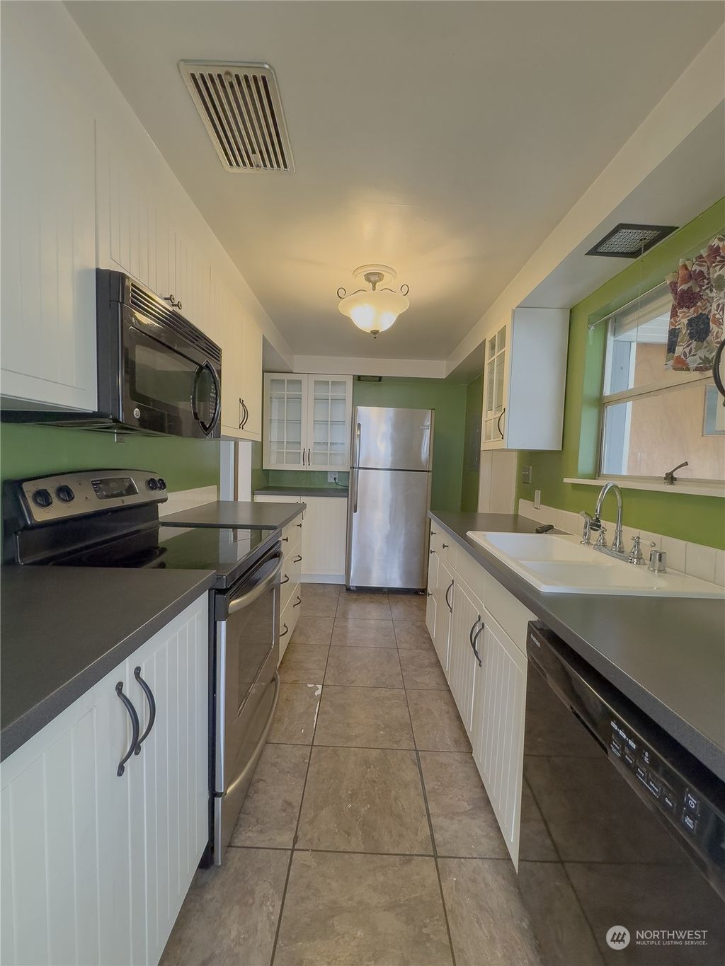 Photo of 7656 S Mission Drive, Seattle, WA 98178 (MLS # 2296015)