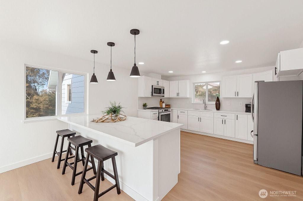 Photo of 8305 Duncan Ave S Ave, Seattle, WA 98118 (MLS # 2456116)